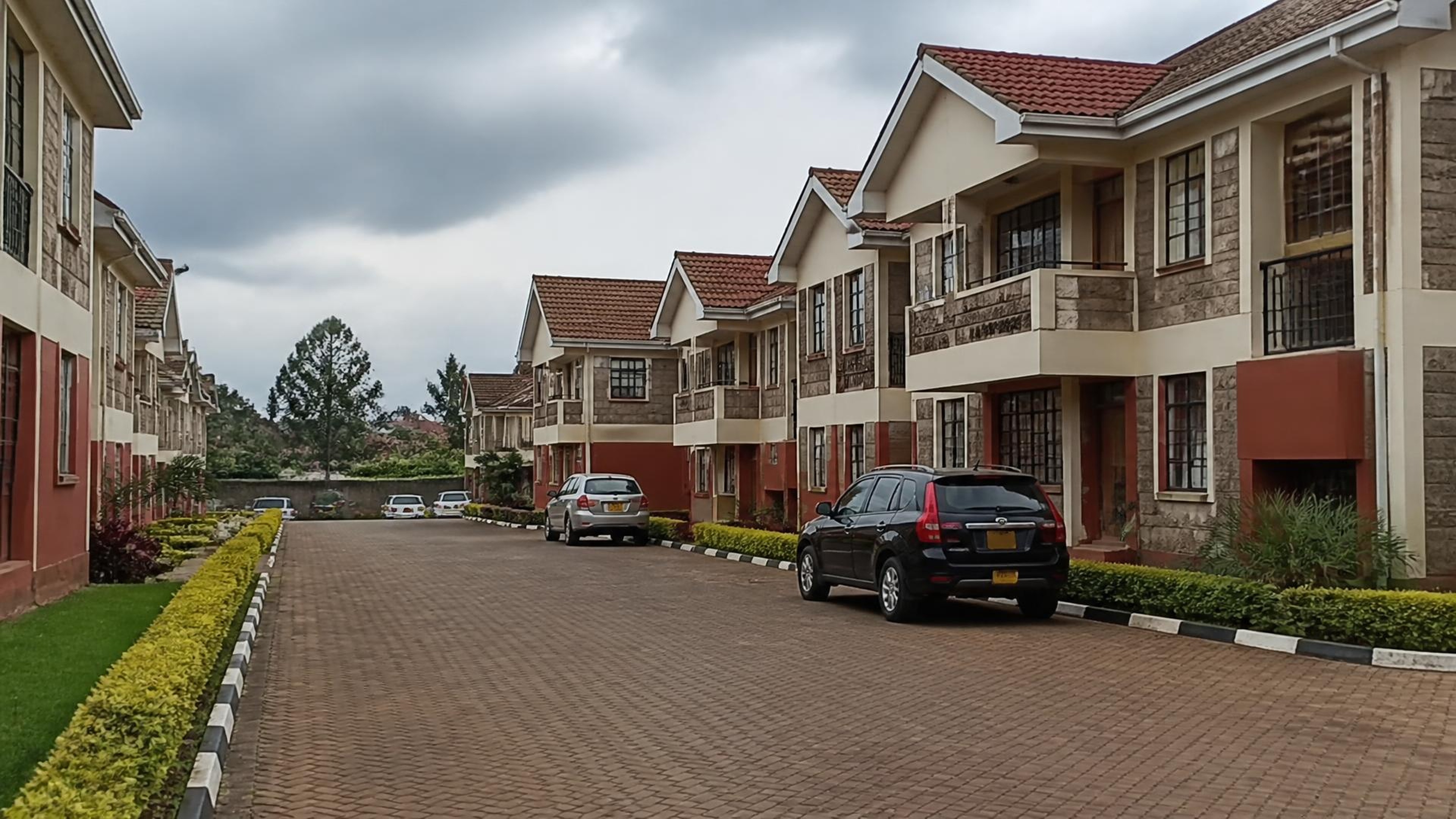 Completed multi-unit maisonette estate with landscaped internal driveway in Kikuyu